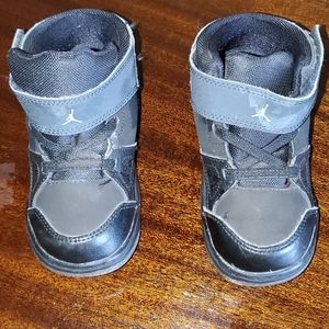 Boys black on black Jordans